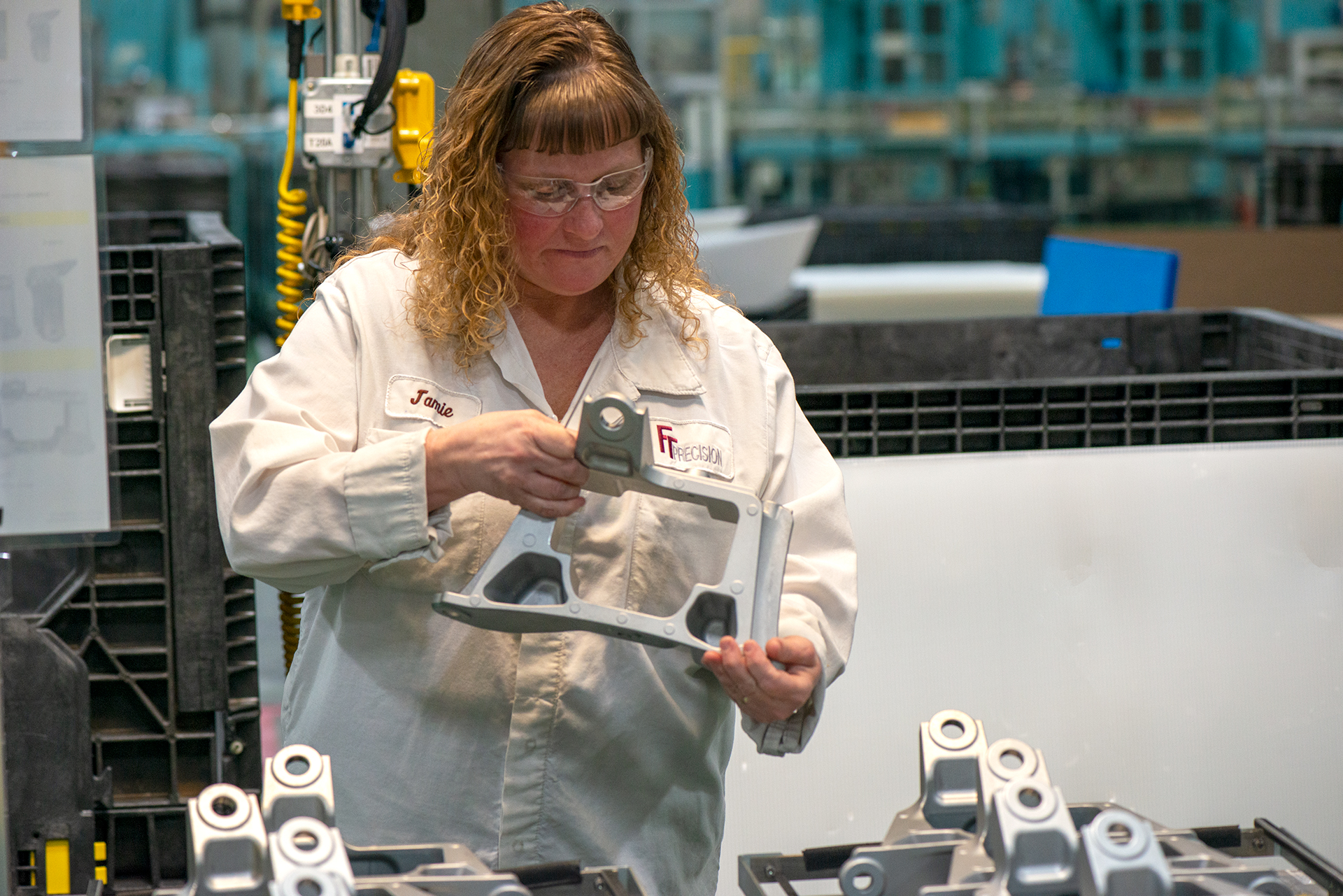 FT Precision employee working on high precision cnc machining