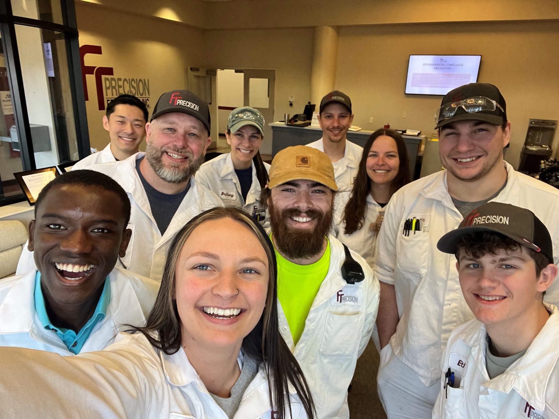 Happy group of FT Precision employees